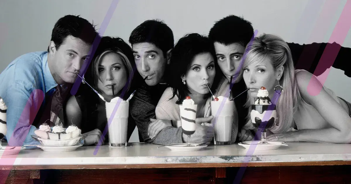 The six main Friends characters drinking milkshakes at a diner